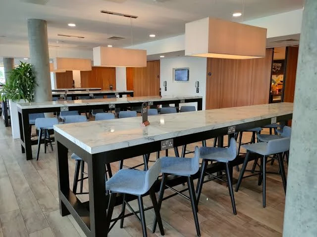Who Gets the Final Say on Bar Stools for a Hotel Lounge?